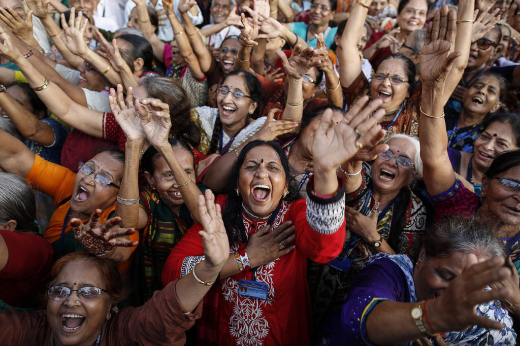 Members of a laughter club participate in a laughing exercise in Mumbai